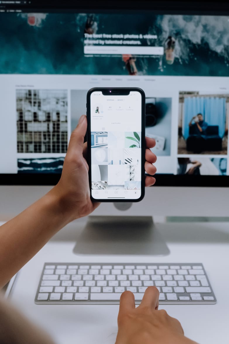 Phone and laptop showing a company website